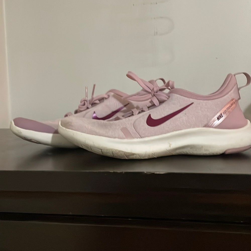 Pink flex Nike womens running shoes.